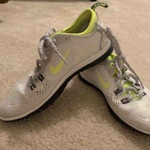 White and yellow women’s Nike sneakers